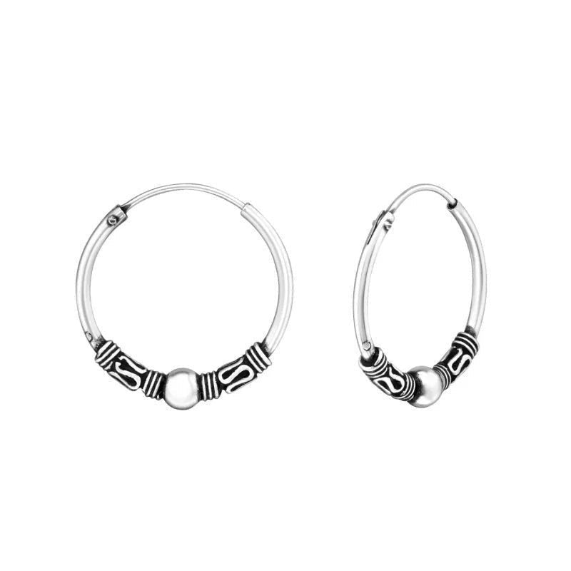 Aramat Jewels 18mm oxidized silver hoop earrings with intricate ethnic Bali design.