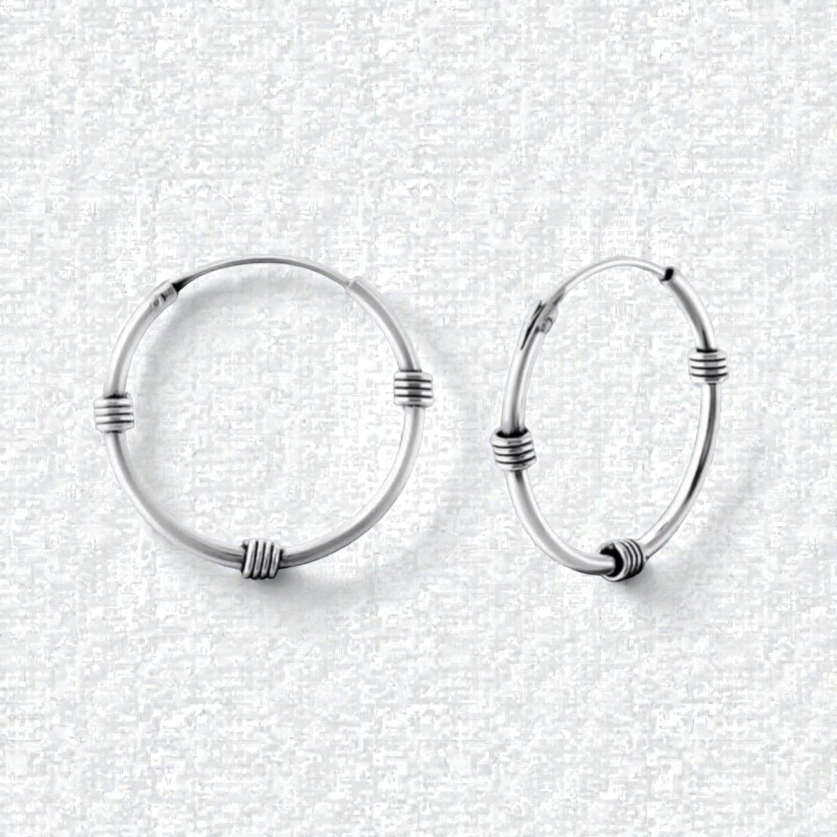 Aramat Jewels oxidized silver Bali hoop earrings, 20mm diameter, with textured detailing. Boho style.