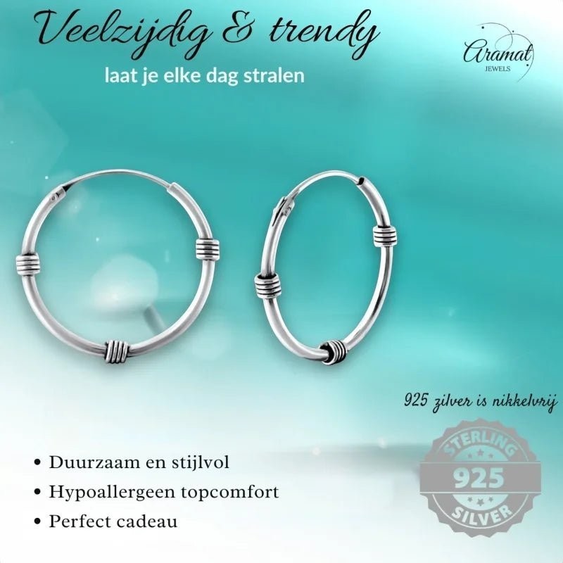 Aramat Jewels pair of 20mm oxidized silver Bali hoop earrings with a rustic, vintage design. Hypoallergenic and nickel-free 925 silver.