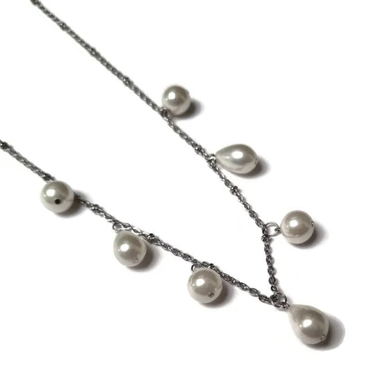 Aramat Jewels silver-tone stainless steel necklace featuring white synthetic round and teardrop-shaped pearls.
