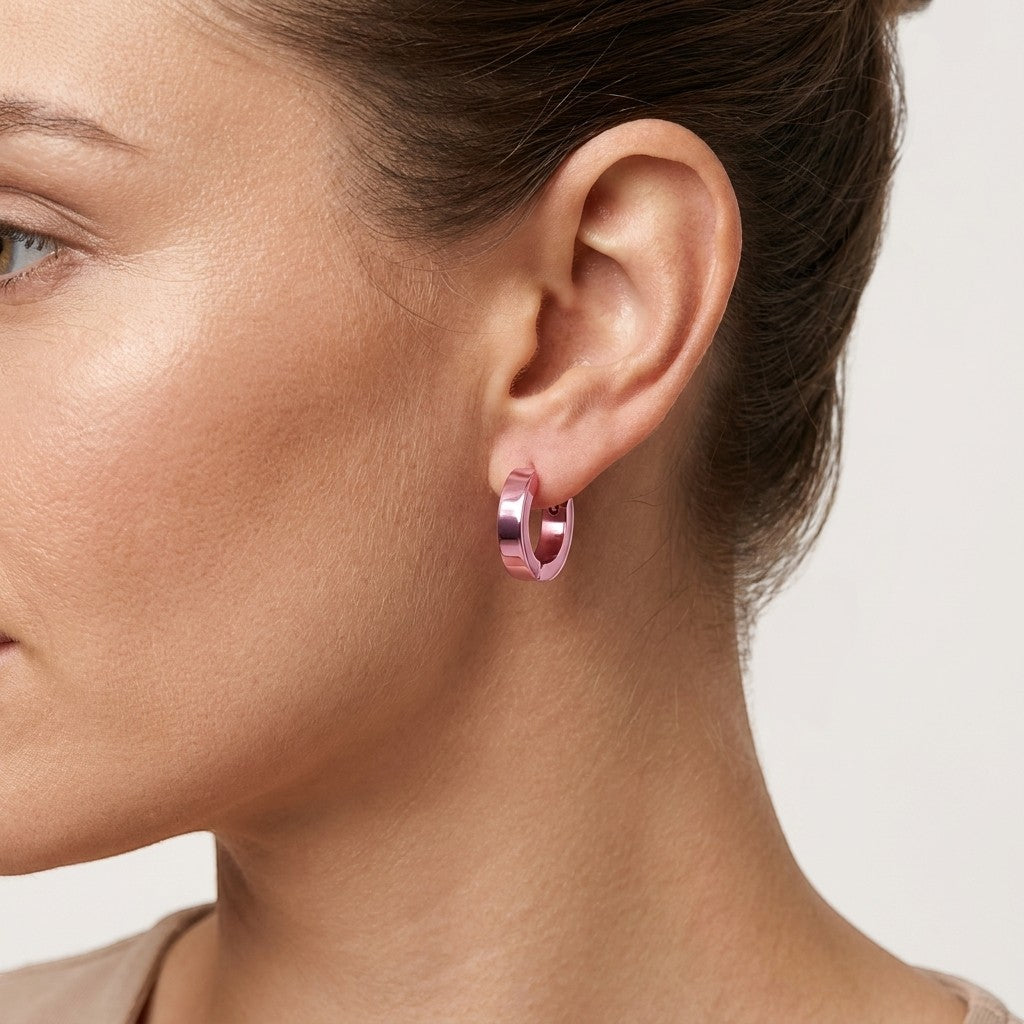 Aramat Jewels stainless steel hoop earrings with a shiny pink finish, 14mm diameter.