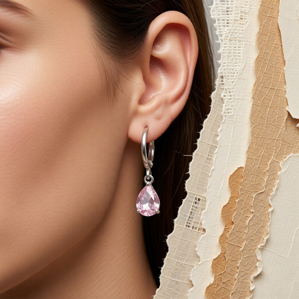 Aramat Jewels silver hoop earrings with a pink pear-shaped zirconia drop for girls.
