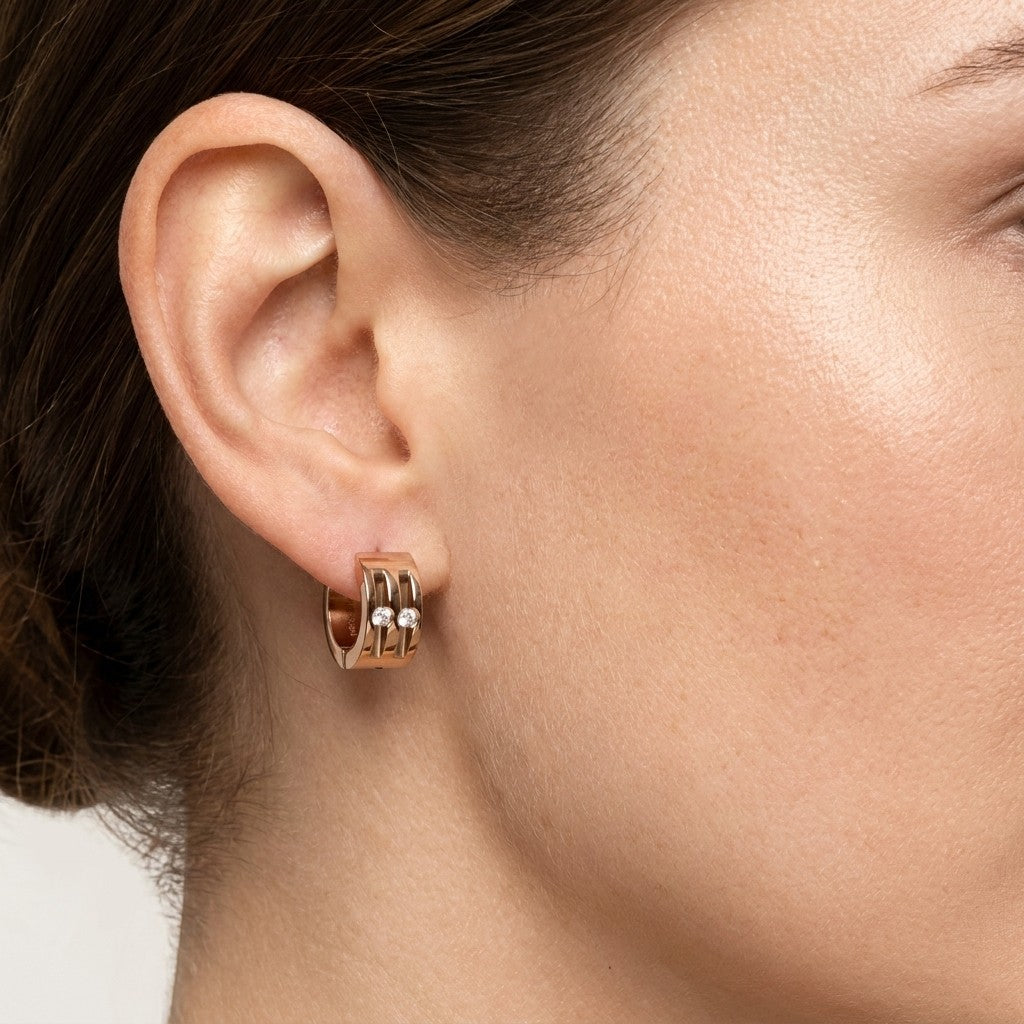 Aramat Jewels rose gold huggie earrings with two clear cubic zirconia stones, 13mm diameter.