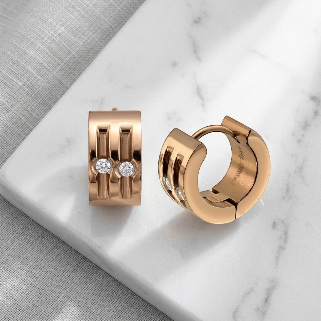 Aramat Jewels rose gold stainless steel huggie earrings with two clear cubic zirconia stones each, 13mm diameter.