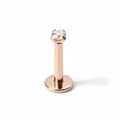 Aramat Jewels rose gold tragus and helix piercing with a 2mm clear zirconia stone set in 316L surgical steel.