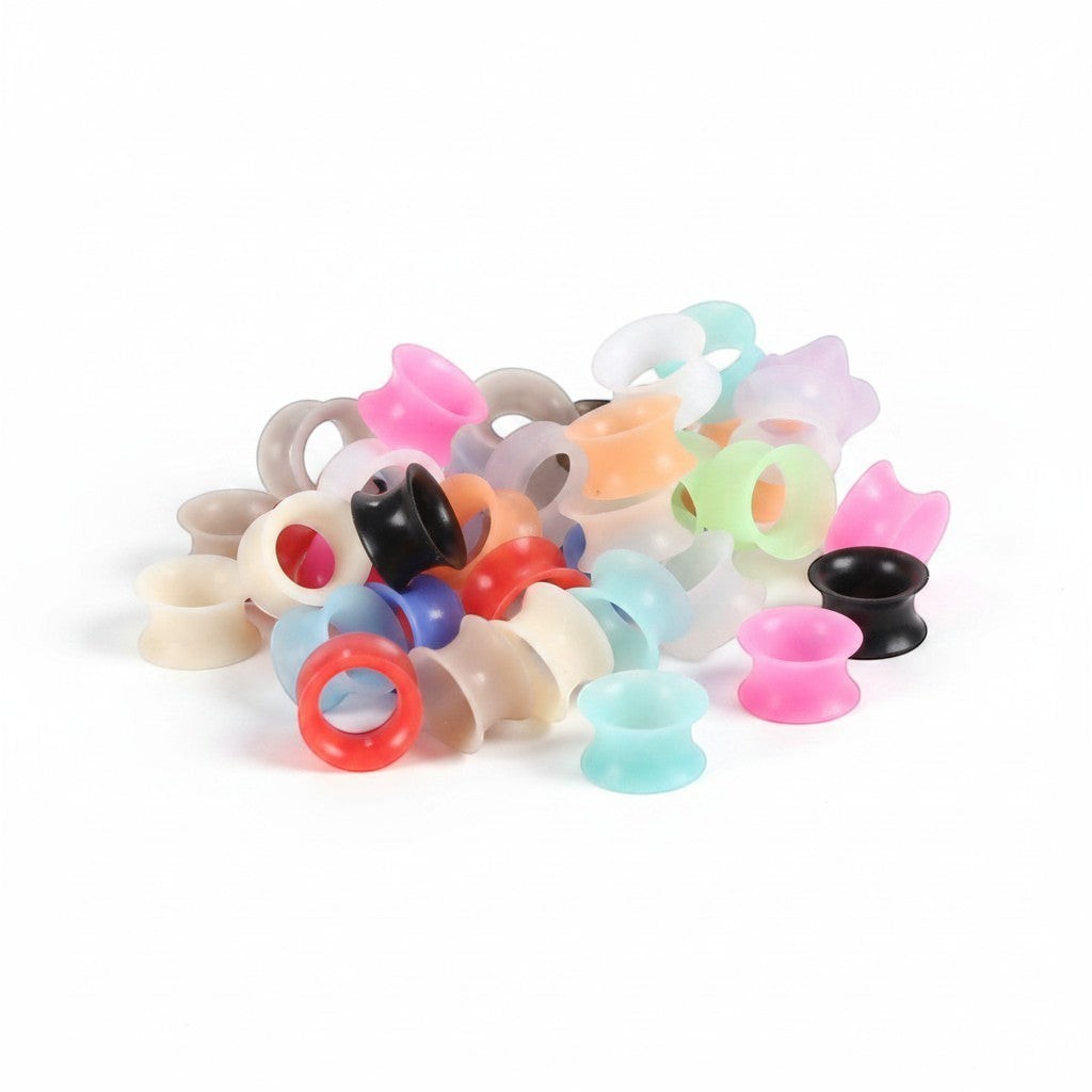 Aramat Jewels set van kleurrijke 8mm siliconen oortunnels, flexibele double flared flesh tunnels voor gestretchte oren.