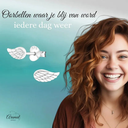Aramat Jewels 925 sterling silver angel wing stud earrings with detailed feather engraving on a smiling woman