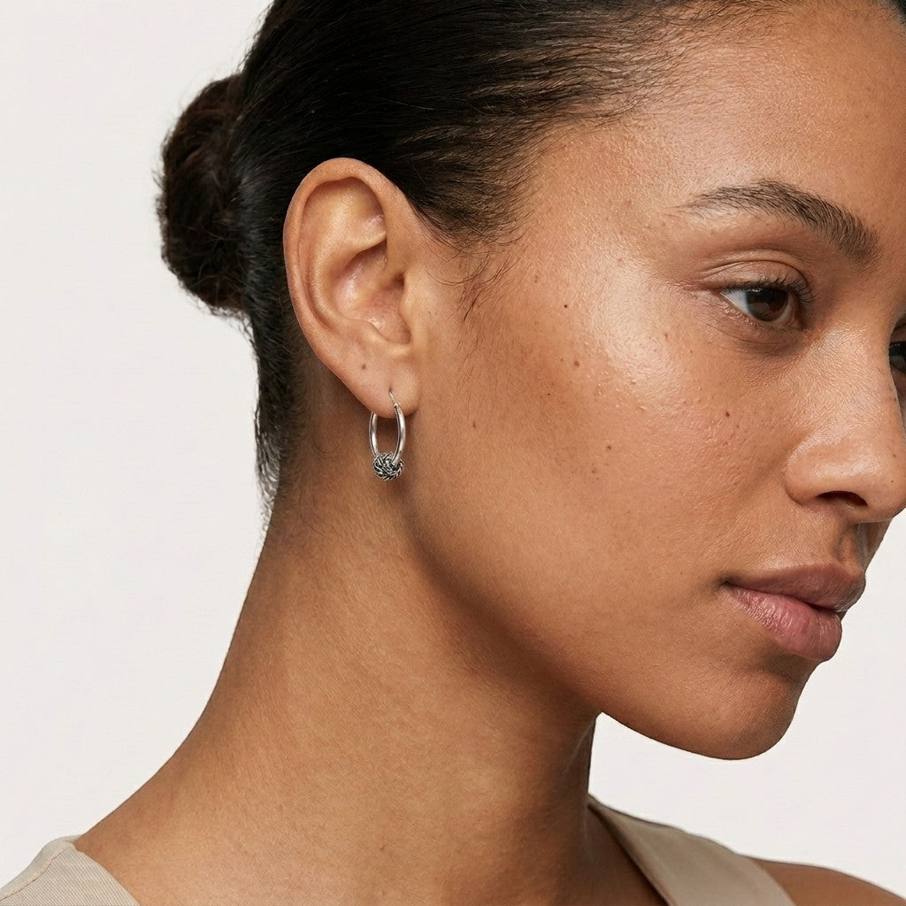 Aramat Jewels 18mm silver Bali hoop earrings with intricate knot detail, featuring an oxidized finish.