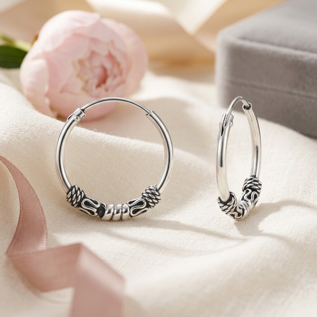 Aramat Jewels thin 16mm silver Bali hoop earrings with intricate tribal detailing, perfect for boho style.