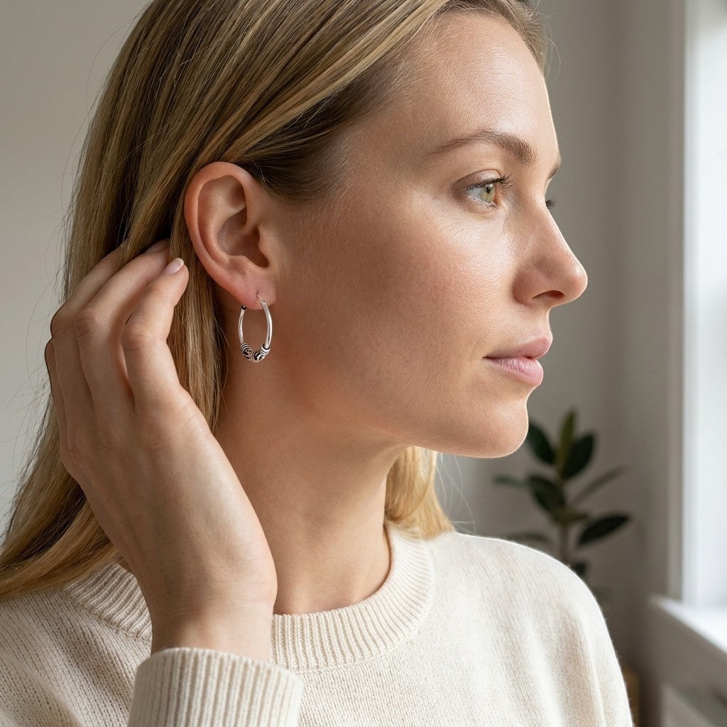 Aramat Jewels unisex 16mm silver Bali hoop earrings with intricate tribal detailing.