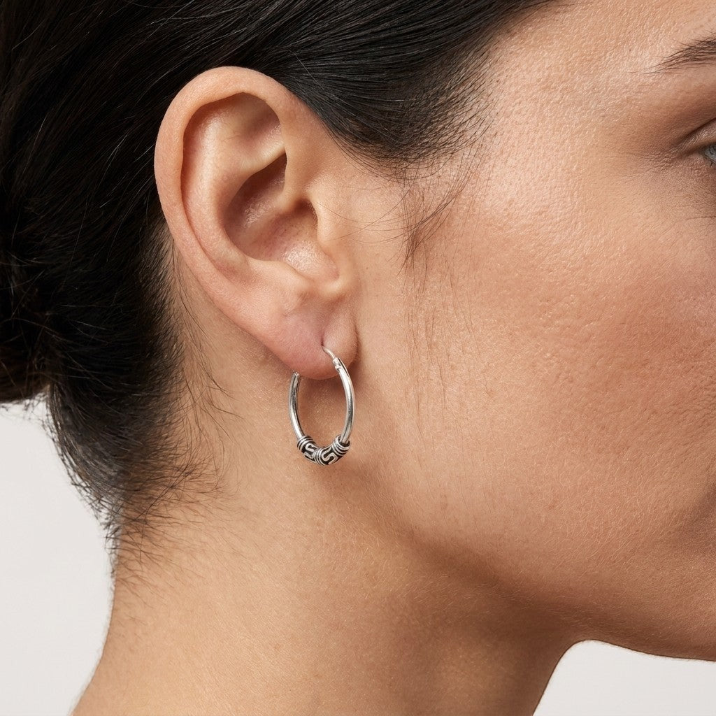 Aramat Jewels unisex 16mm silver Bali hoop earrings with intricate detailing.