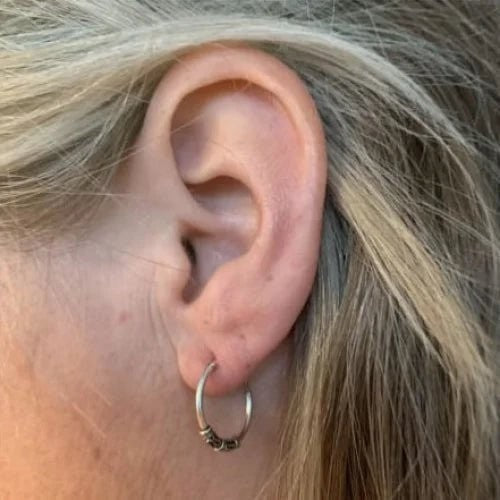 Aramat Jewels unisex 16mm silver Bali hoop earrings with intricate detailing.