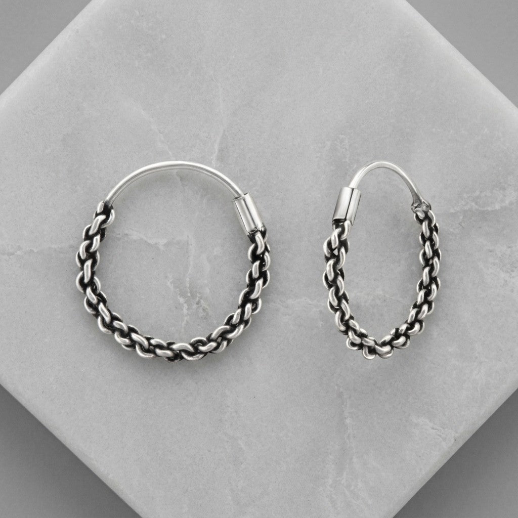 Aramat Jewels small silver Bali hoop earrings, 16mm, with intricate braided texture and ethnic design.