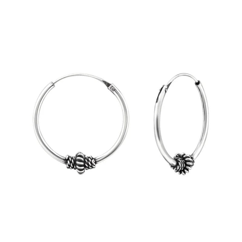 Aramat Jewels silver Bali hoop earrings, 18mm diameter, with intricate ethnic bead detail. Oxidized silver finish.