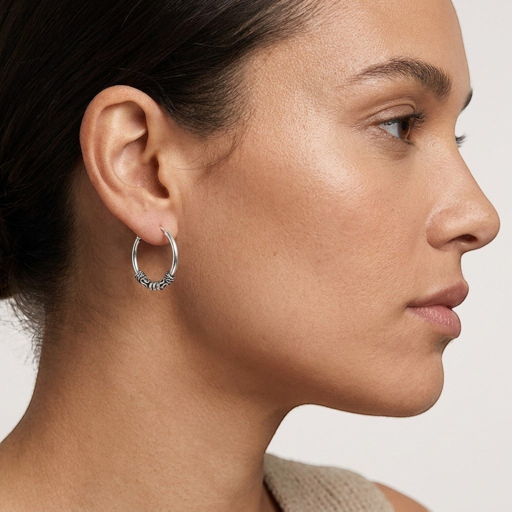 Aramat Jewels unisex 16mm silver Bali hoop earrings with intricate tribal detailing.