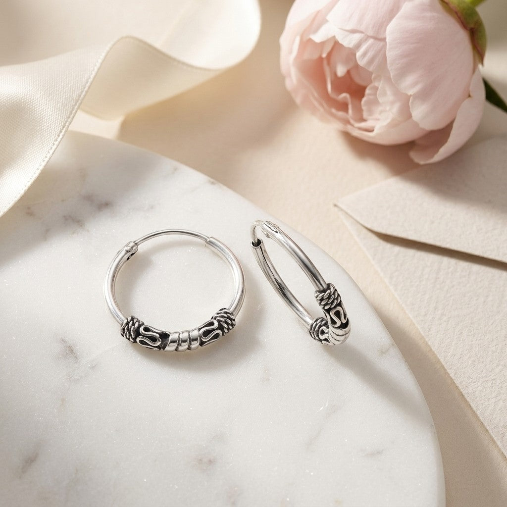 Aramat Jewels unisex 16mm silver Bali hoop earrings with intricate ethnic detailing.