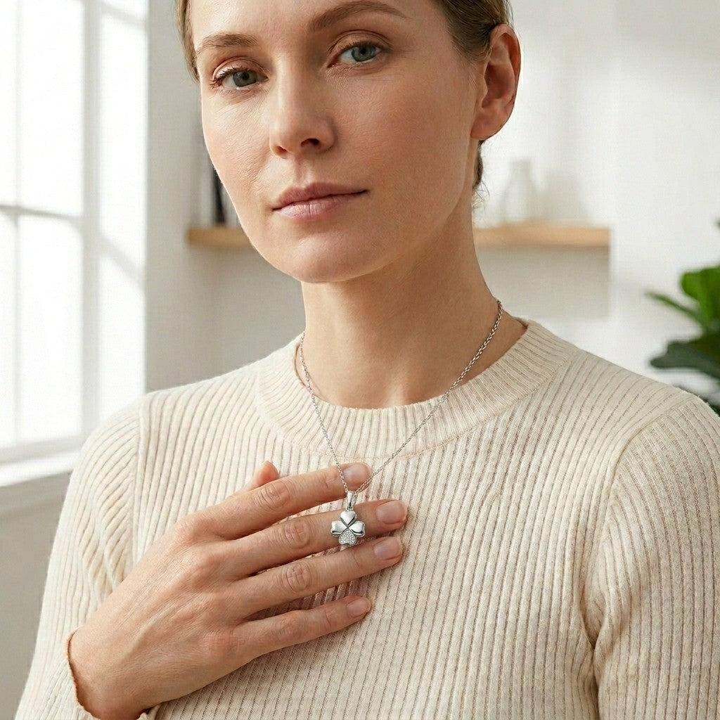 Aramat Jewels silver-tone stainless steel four-leaf clover cremation pendant with clear cubic zirconia.