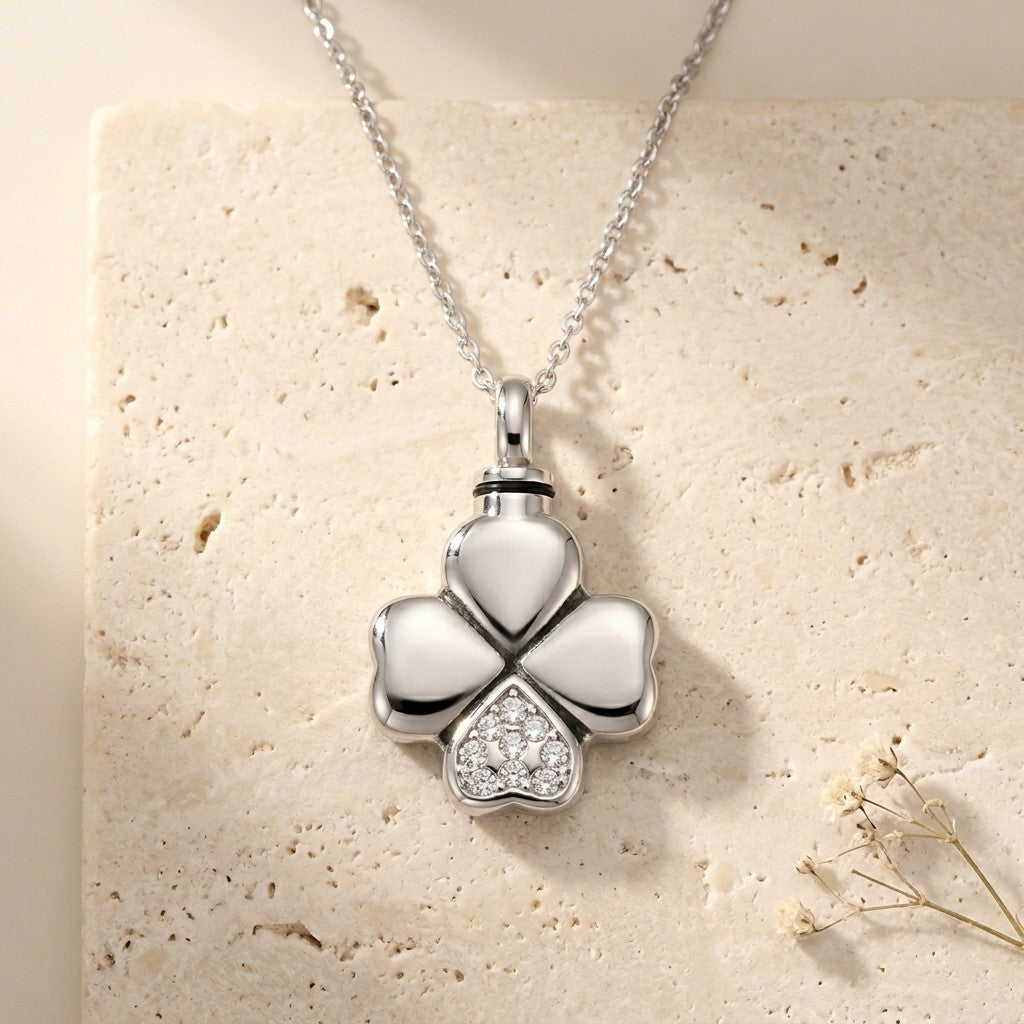 Aramat Jewels silver-tone stainless steel four-leaf clover cremation pendant with clear cubic zirconia detail.