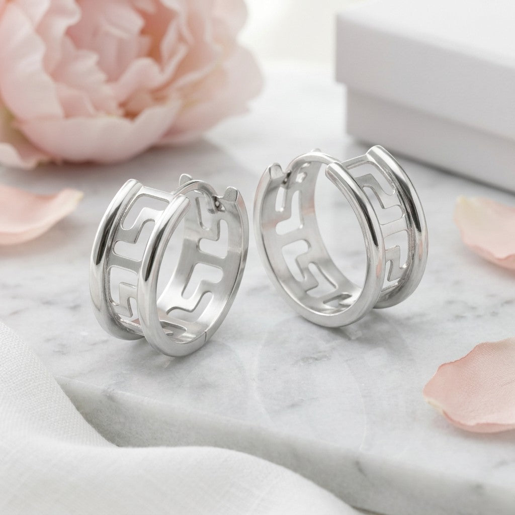 Aramat Jewels silver-tone stainless steel hoop earrings with Greek key pattern, 20mm diameter.