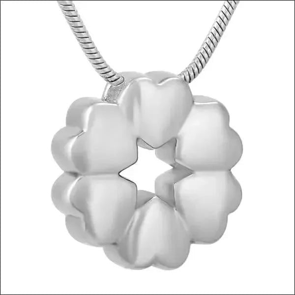Aramat Jewels silver stainless steel circular cremation pendant with heart details, 20x20mm.