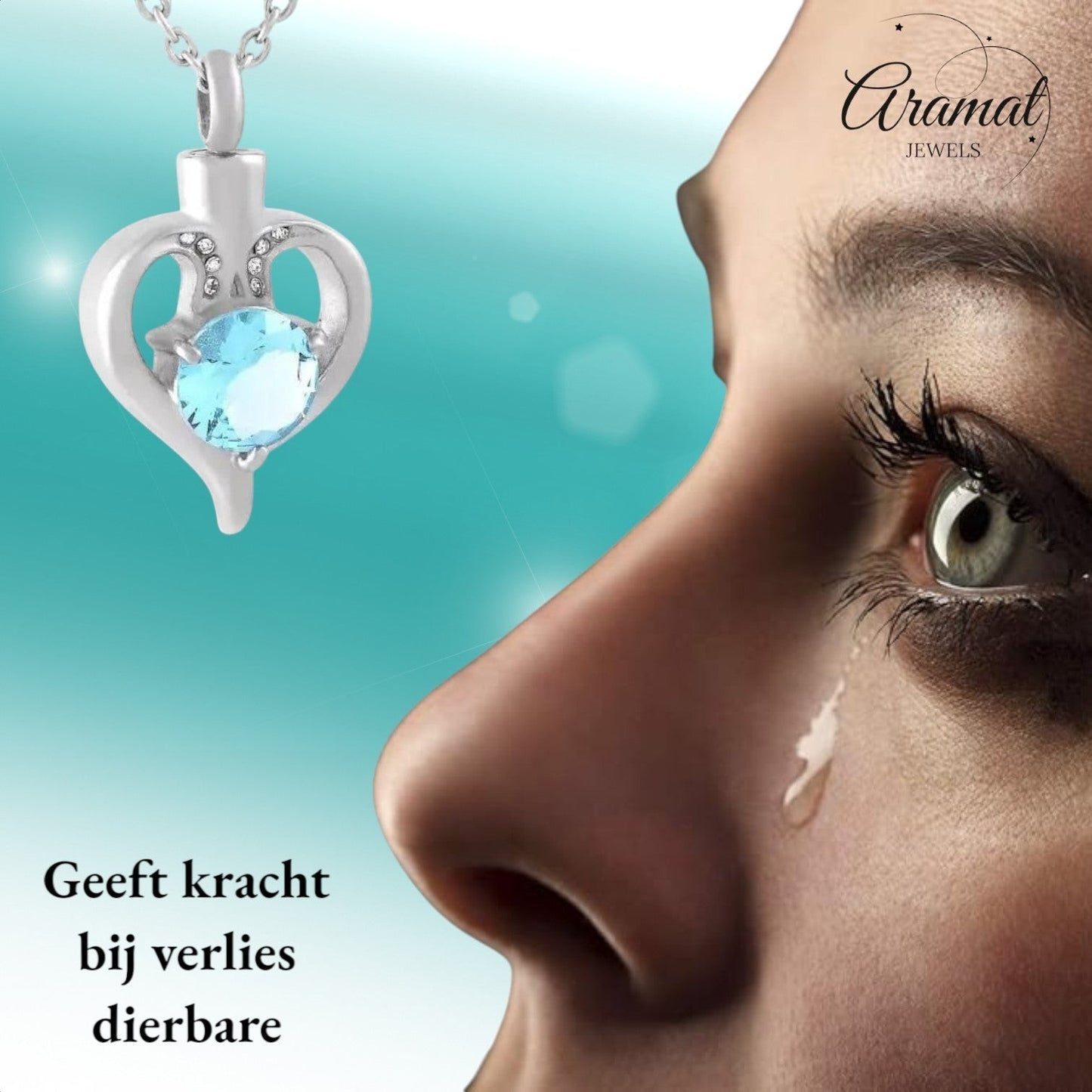 Aramat Jewels silver-tone stainless steel heart-shaped cremation urn pendant with a blue cubic zirconia and small clear crystals.