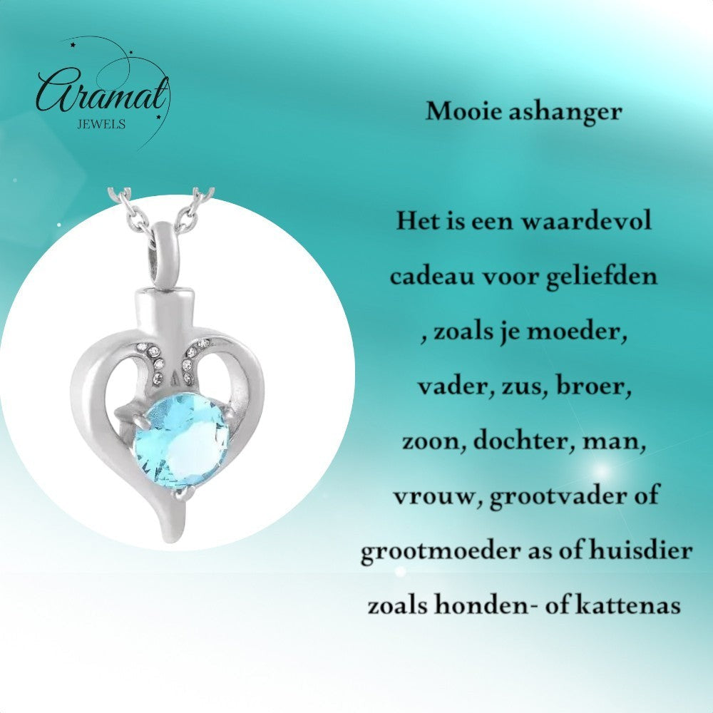 Aramat Jewels silver-tone stainless steel heart-shaped cremation urn pendant with a blue zirconia and small clear crystals.