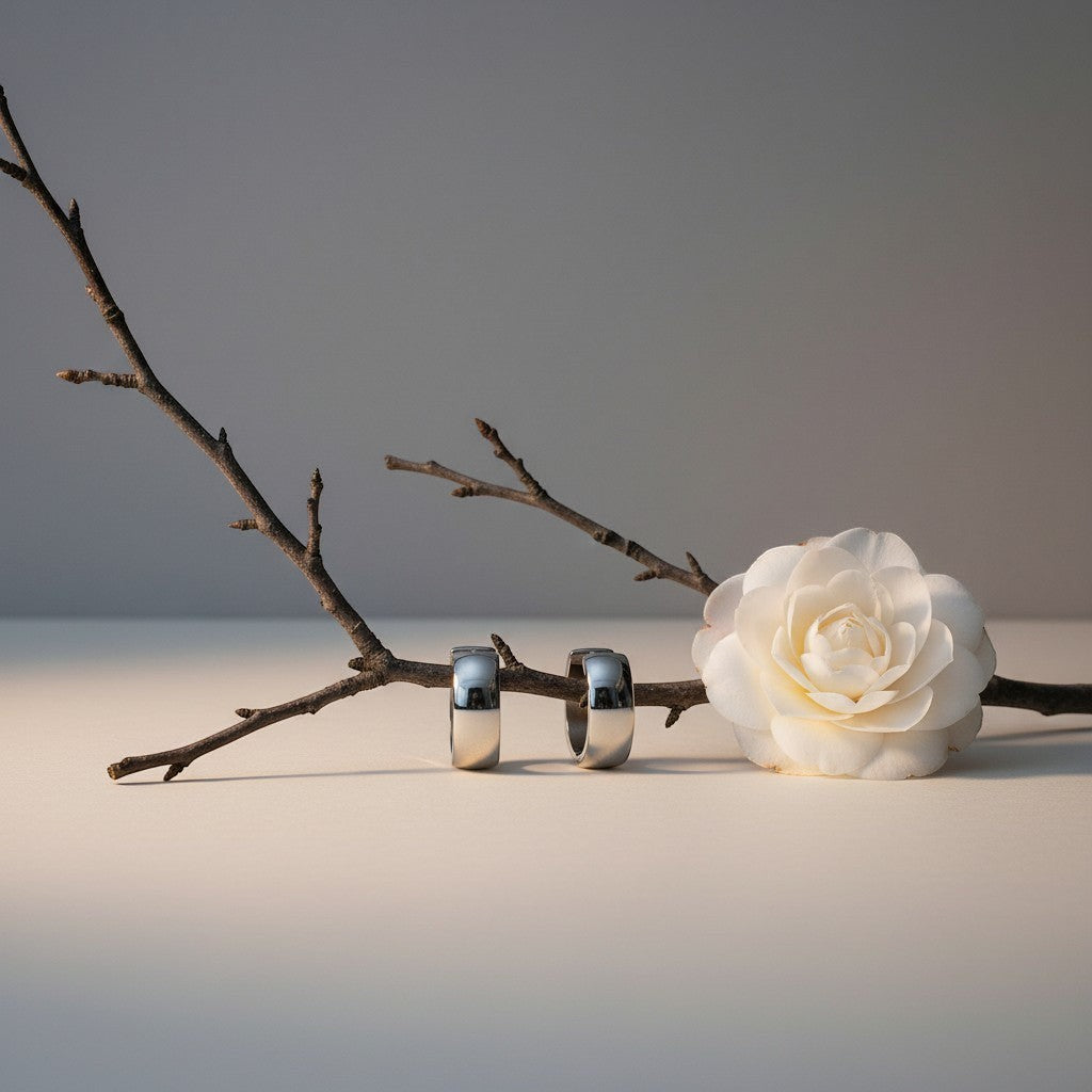 Aramat Jewels silver-coloured stainless steel hoop earrings, 13mm diameter, simple and timeless design, unisex.