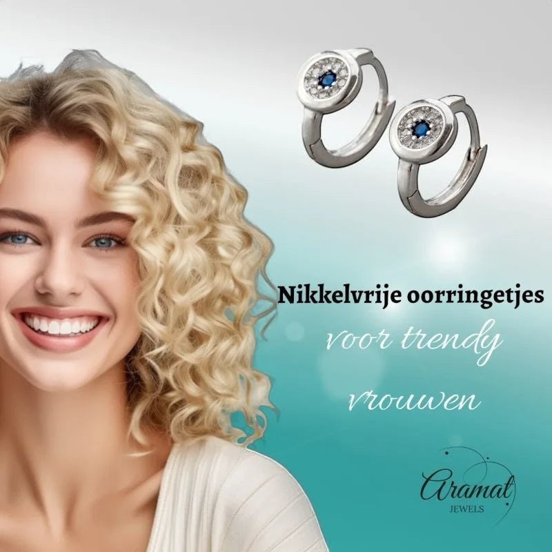 Aramat Jewels silver hoop earrings with blue and clear cubic zirconia, 12mm diameter, worn by a smiling woman with blonde curly hair.