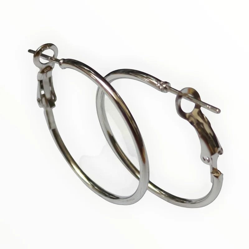 Aramat Jewels silver-colored stainless steel hoop earrings with a high-gloss finish and hinge closure.