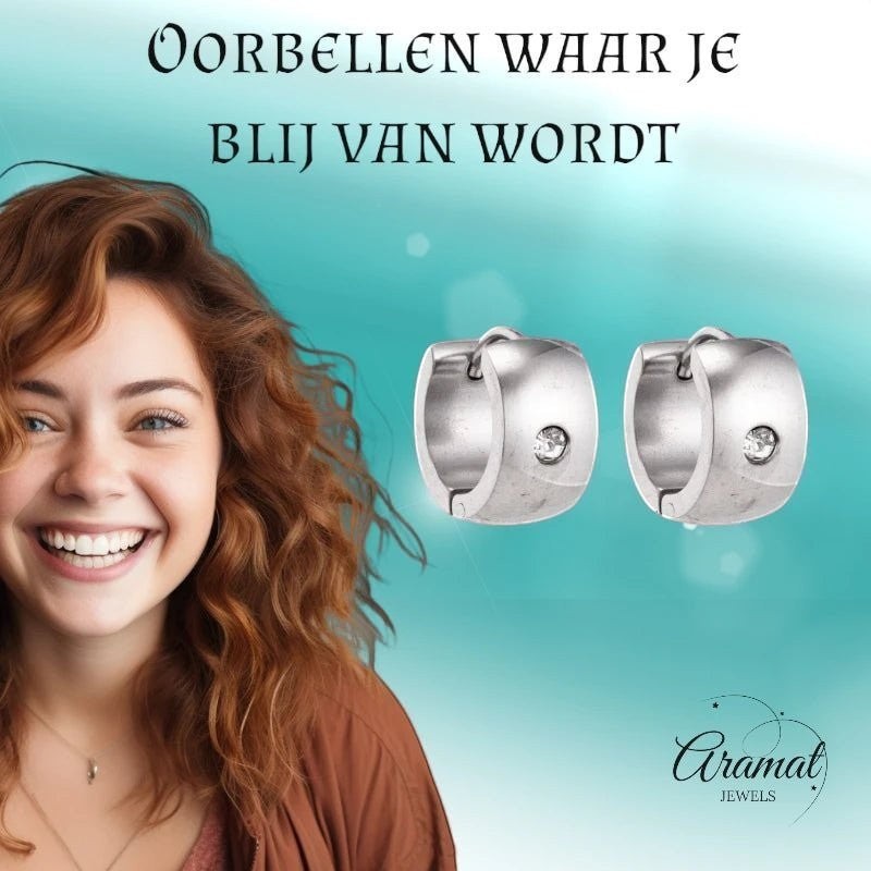 Aramat Jewels silver-colored wide stainless steel hoop earrings with a clear cubic zirconia stone. Unisex design.