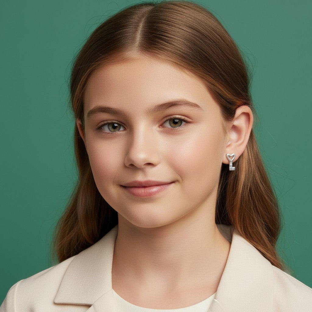 Aramat Jewels sterling silver key stud earrings for girls, 6x4mm, with a heart-shaped opening.