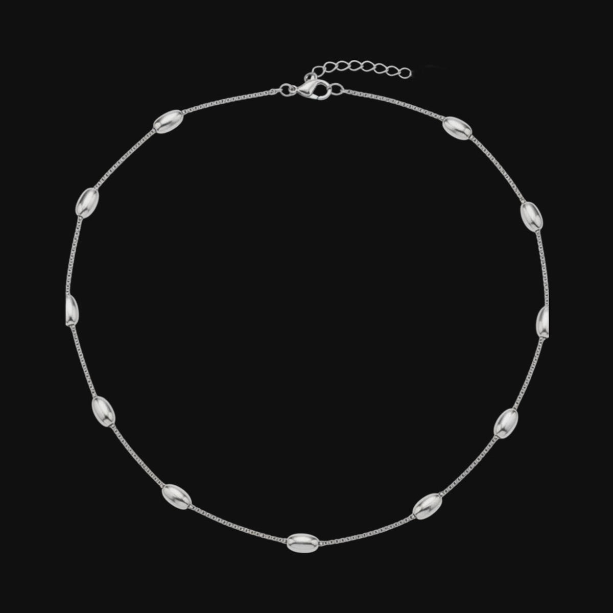 Aramat Jewels silver-tone stainless steel necklace featuring delicate oval bead links, 5mm wide and adjustable.