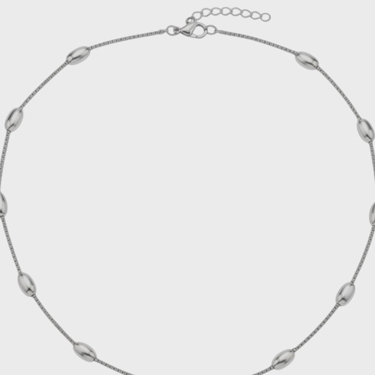 Aramat Jewels silver-colored stainless steel necklace with oval bead links, 5mm wide, featuring a lobster clasp.