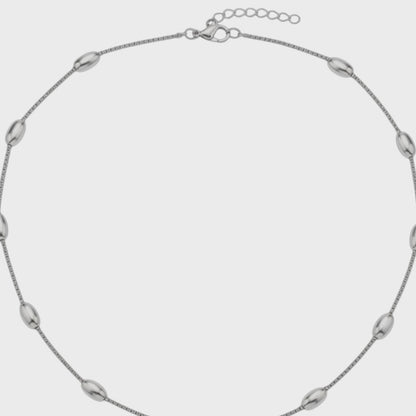 Aramat Jewels silver-colored stainless steel necklace with oval bead links, 5mm wide, featuring a lobster clasp.