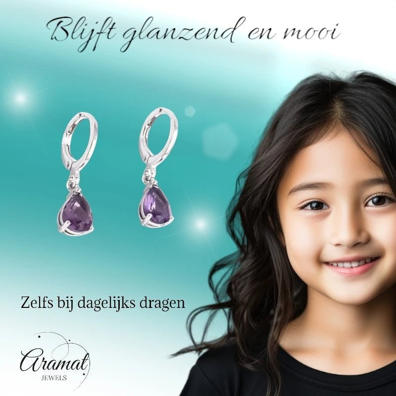 Aramat Jewels silver-tone stainless steel huggie earrings with dangling purple teardrop zirconia stones on a young girl.