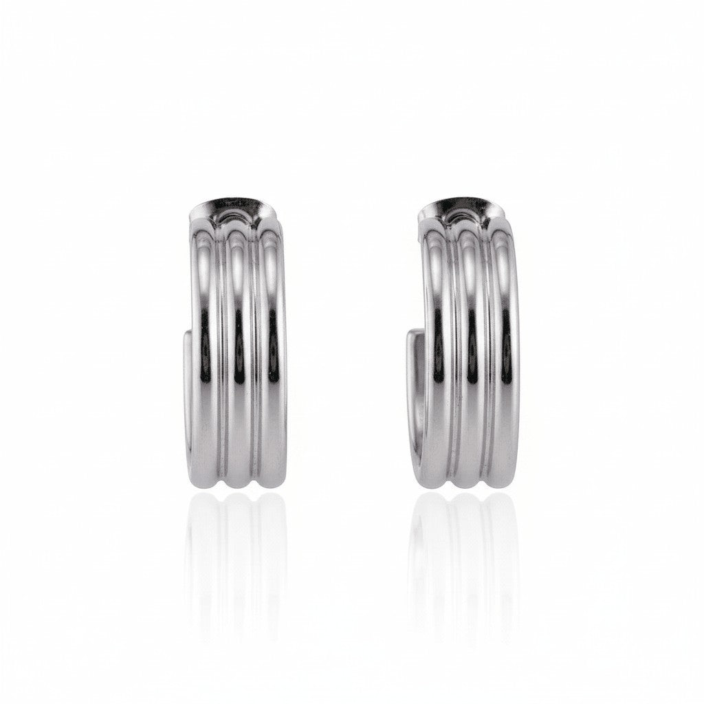 Aramat Jewels silver-tone stainless steel half hoop earrings with ribbed texture, 23x7mm.