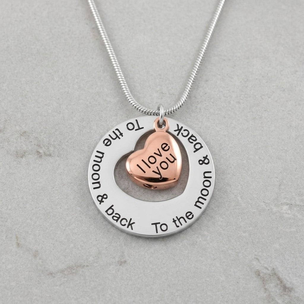 Aramat Jewels silver and rose gold heart cremation necklace with "I love you" engraving and outer circle engraved "To the moon & back".