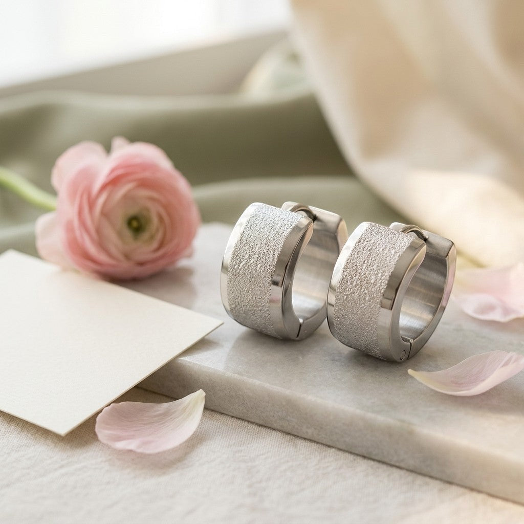 Aramat Jewels sandblasted silver-tone stainless steel huggie hoop earrings with a wide textured stripe.