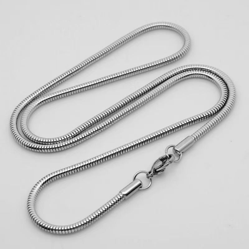 Aramat Jewels silver-colored round snake chain necklace made of water-resistant stainless steel with lobster clasp.