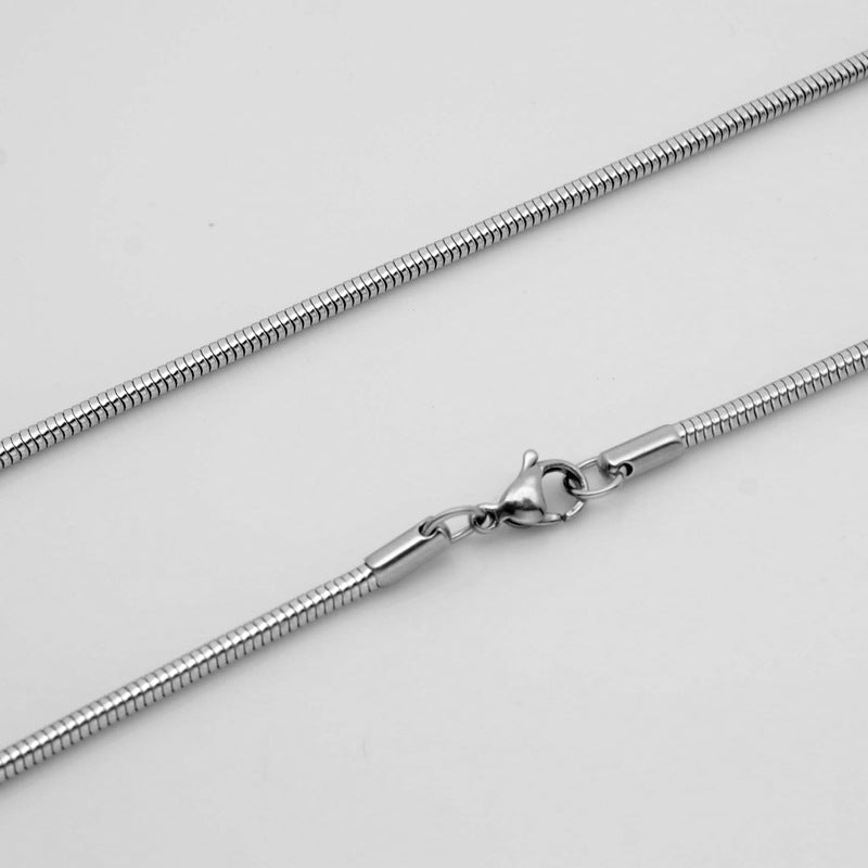 Aramat Jewels silver-colored round snake chain necklace made of durable stainless steel with a lobster clasp.