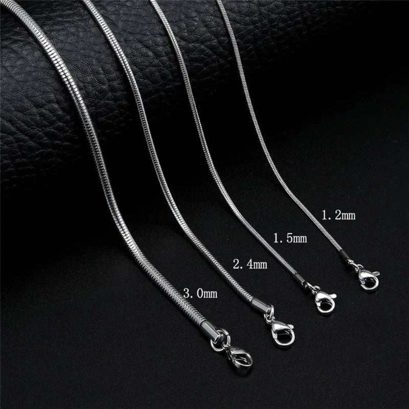 Aramat Jewels silver-colored stainless steel round snake chains in four different thicknesses with lobster clasps.