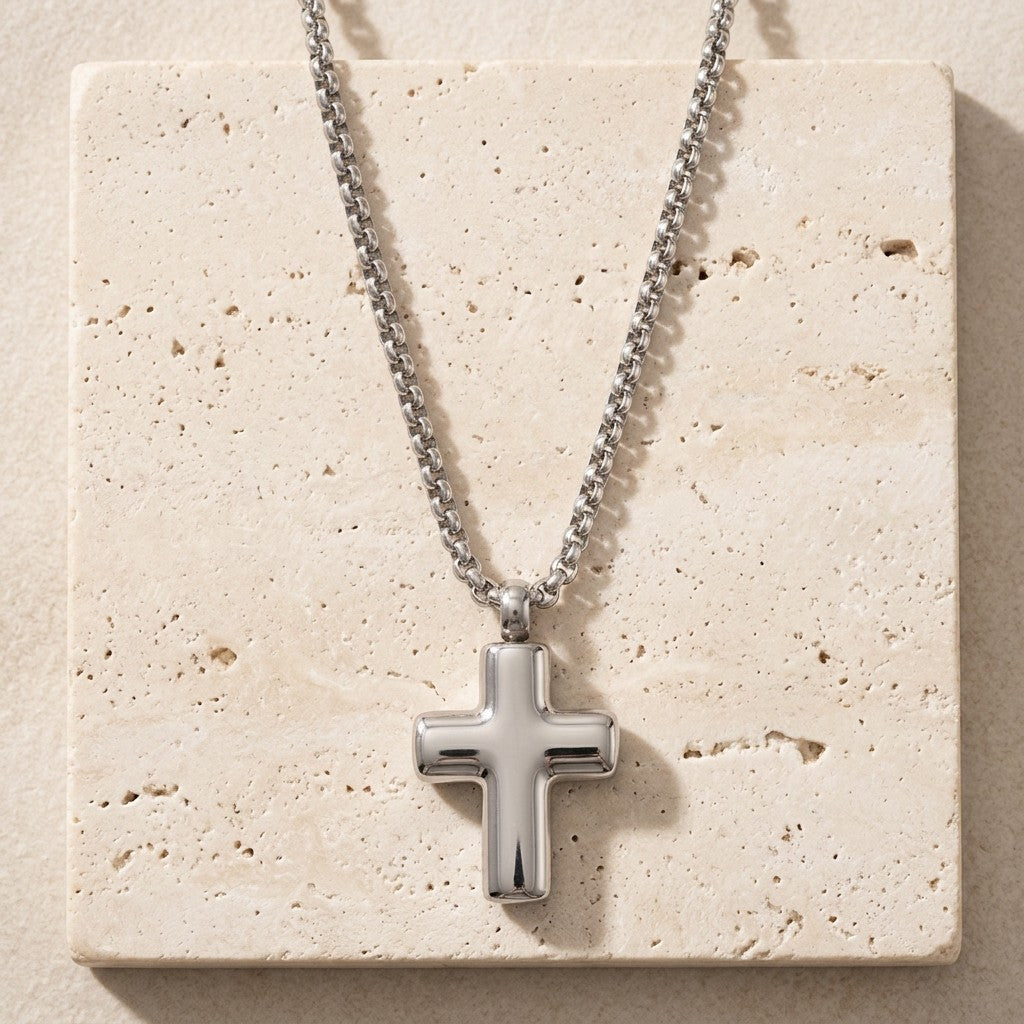 Aramat Jewels silver-coloured 316L steel cross cremation pendant, 2x1.5cm, with a simple box chain.