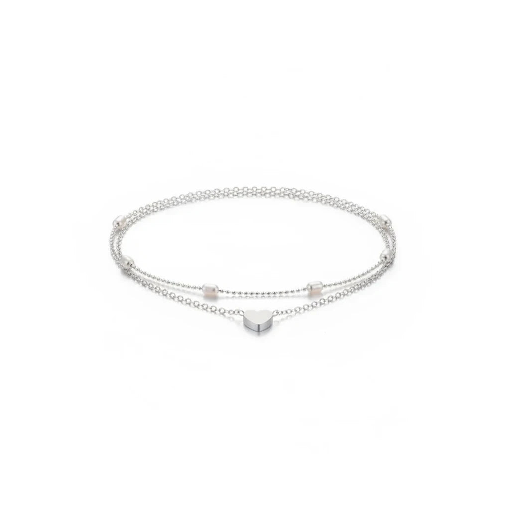 Aramat Jewels silver-toned steel anklet set featuring a delicate heart charm and small beads on a fine chain.