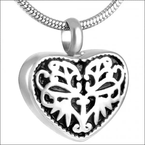 Aramat Jewels silver-coloured steel heart-shaped cremation pendant with black enamel filigree detail.