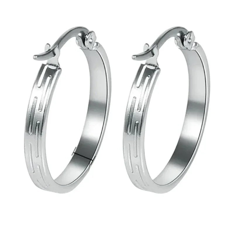 Aramat Jewels silver-tone stainless steel hoop earrings with a subtle striped pattern, 20mm diameter.