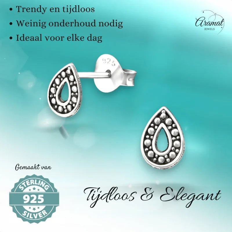 Aramat Jewels 925 sterling silver teardrop stud earrings with oxidized Bali-style bead pattern and open center