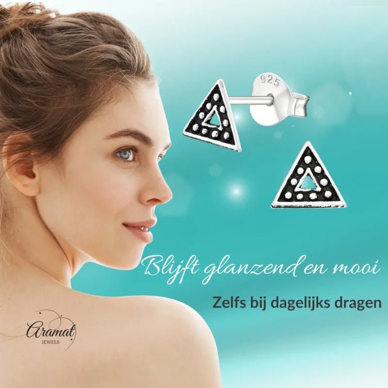 Aramat Jewels 925 sterling silver triangle stud earrings with Bali-style beaded pattern and dark oxidized finish.