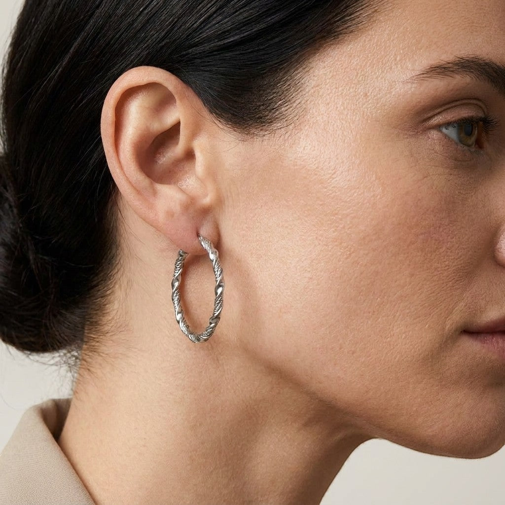 Aramat Jewels silver-tone stainless steel twisted hoop earrings, 30mm or 40mm diameter, 3mm width.