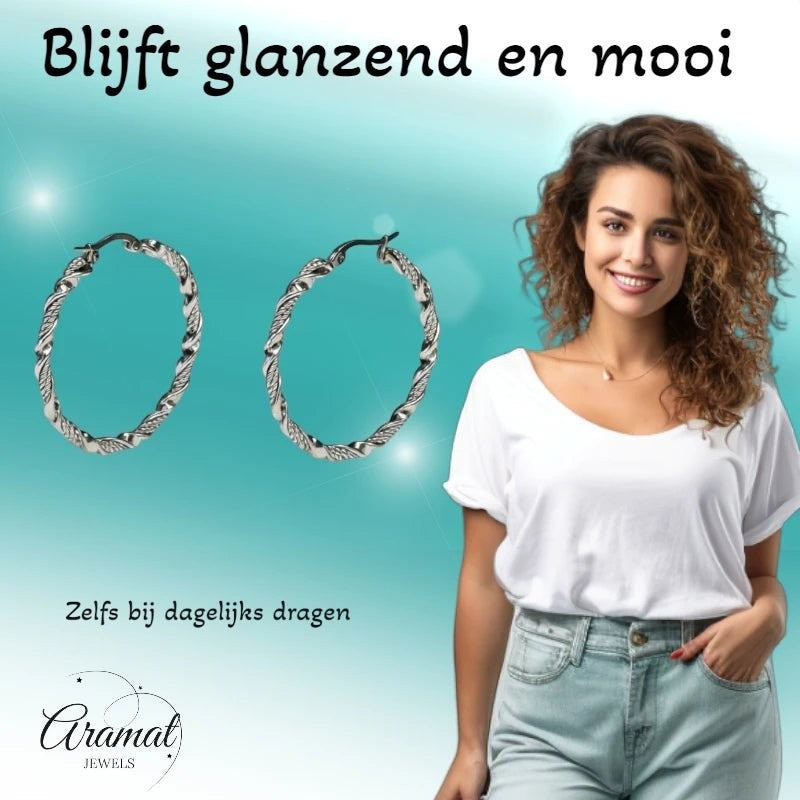 Aramat Jewels silver-tone stainless steel twisted hoop earrings, 30mm or 40mm diameter, with a polished finish.