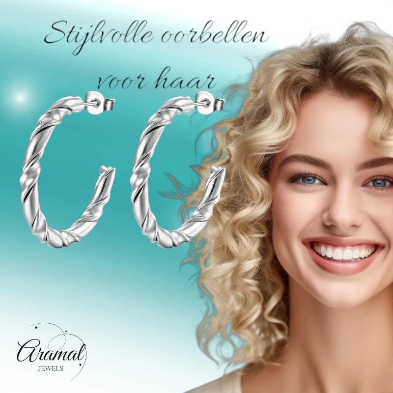 Aramat Jewels silver-colored stainless steel twisted rope pattern hoop earrings on a woman with blonde hair